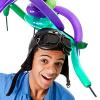 A man wearing blue overalls and a old leather flying cap with balloons around his head.