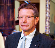 picture of a man wearing a suit and glasses