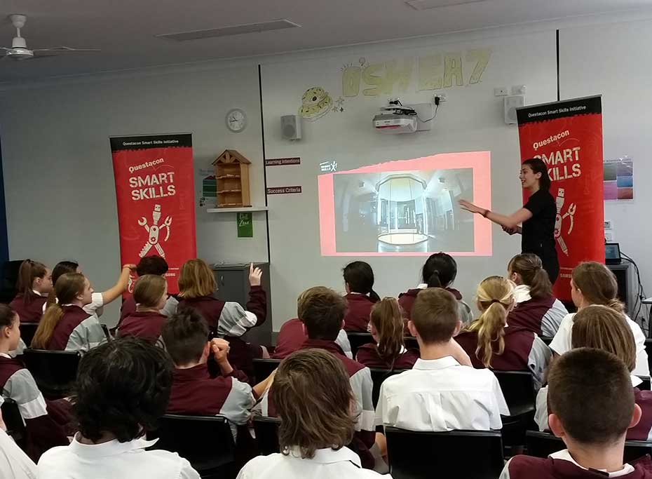A Smart Skill presenter in front of a class of students