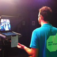 a man facing a tv screen