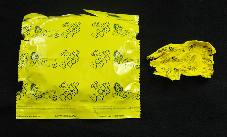 The manufacturers of the ice block wrappers selected polyethylene terephthalate, or PET, to make the wrappers because PET is inexpensive, easy to work with and lightweight. A melted yellow plastic ice-cream wrapper, next to an unmelted version. The melted one is about 25% the size of the original.