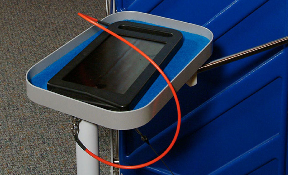 Hold the frame up to the light. Push in the lever and watch the panel. A black framed filter with a red cord attached to a blue and grey tray.