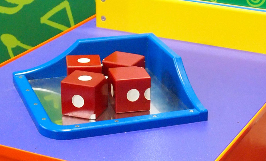Construct a die puzzle, so each visible face shows 6, 5 and 3 dots respectively. Four red and white die, site in a blue and reflective surfaced tray on a purple flat surface.