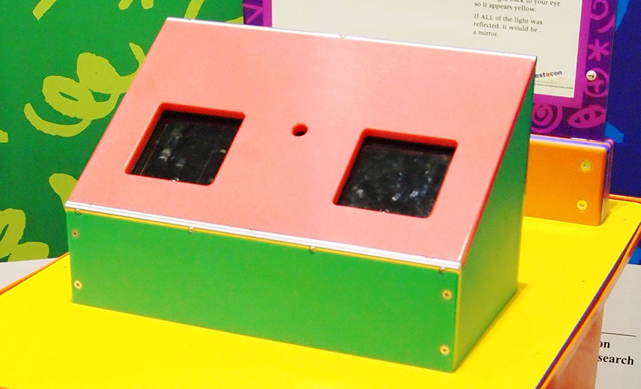 Peer into a box, then open the lid to reveal the colour of the box