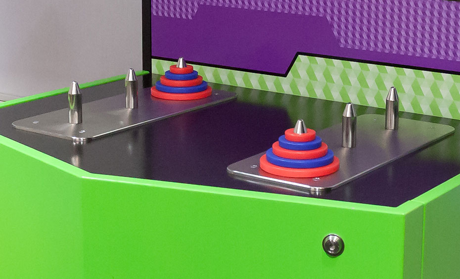 Let's try the puzzle with three discs. How can the number of discs be used to calculate the minimum number of moves? 6 steel spikes with two of them having red and blue discs attached.