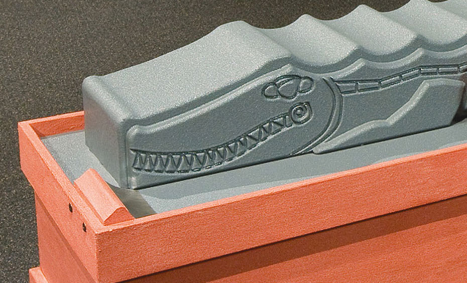 It's important to define exactly what is being measured, in order for accurate measurements to be taken. A grey plastic crocodile lays on an orange table.