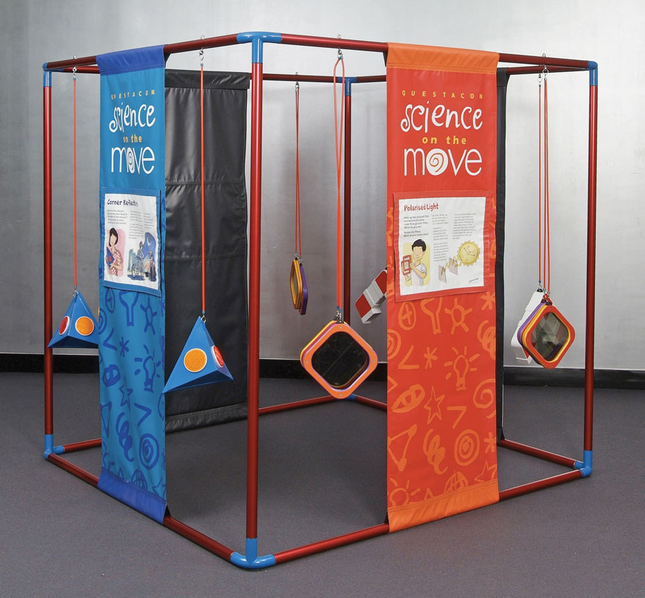 Read the ink colour out loud, while being confused by the colours being named by the words in this Stroop test. A large red and blue cube frame that has orange and blue information panels hanging from top to bottom. Inbetween these panels are blue and orange trianguular and square objects.