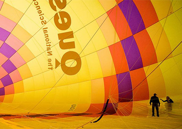 Two people standing in the inside of the Questacon hot air balloon