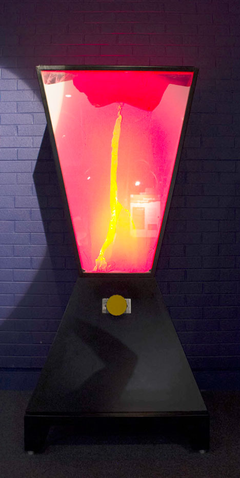 A model of how magma moves up through to the Earth's surface to create volcanoes and cinder cones. A trapezoid shape with red, pinks and yellows in the centre.
