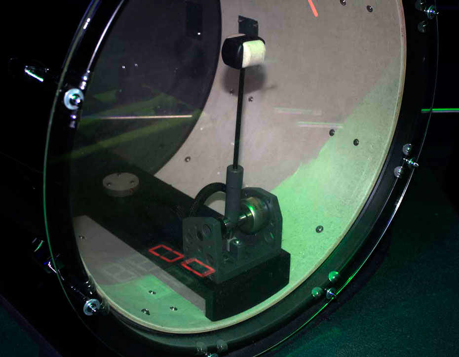 Will the drum beat faster or slower if you do five star-jumps before holding the bar? A close up of a kit drum.