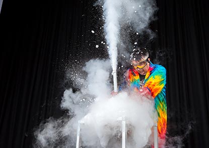 A science performer doing an experiment