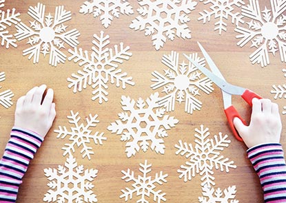 Several paper cutout snowflakes