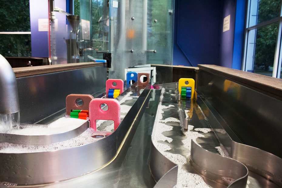 Different exhibit sections have been designed to encourage children to splash, redirect and lift water, or test whether objects float or sink, according to the child's developmental stage. Stainless steel water ways with plastic stops allow the water to flow or dam.