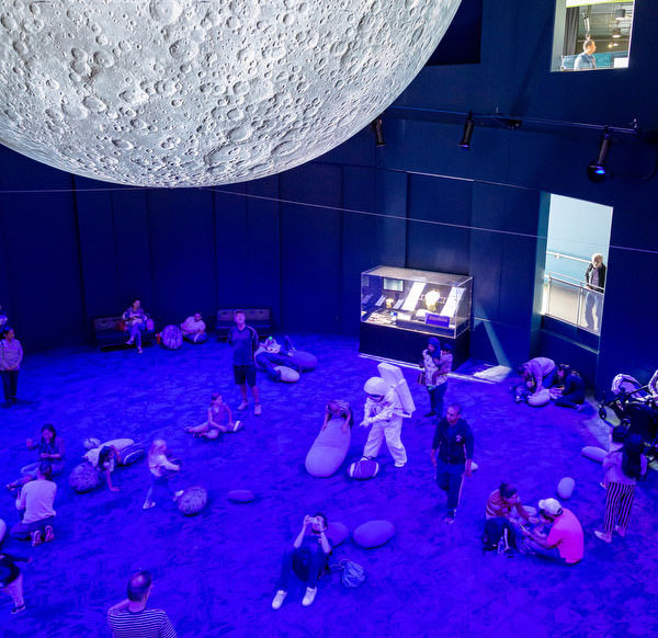 People viewing the Moon exhibit at Questacon