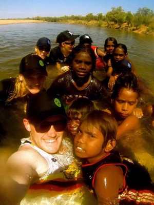 Mick Spencer, founder of ONTHEGO SPORTS, hangs out with  kids he's helped through the Fair Game program.