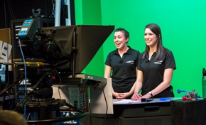Two presenters presenting to a video camera
