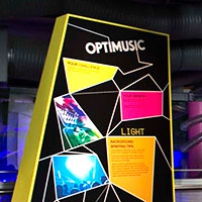 A multi coloured sign with the words 'Optimusic' at the top