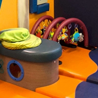Brightly coloured soft play matts and toys for babies.