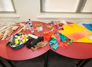 materials spread across two tables